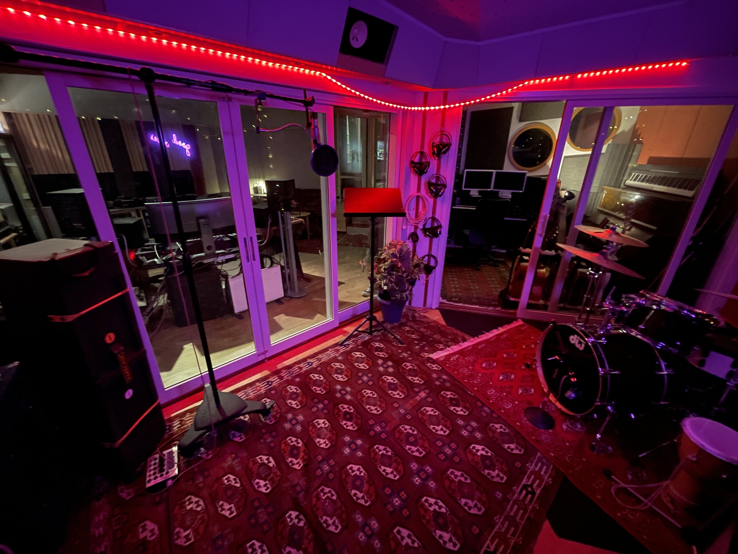 Vocal booth with red LED lighting and tracking setup