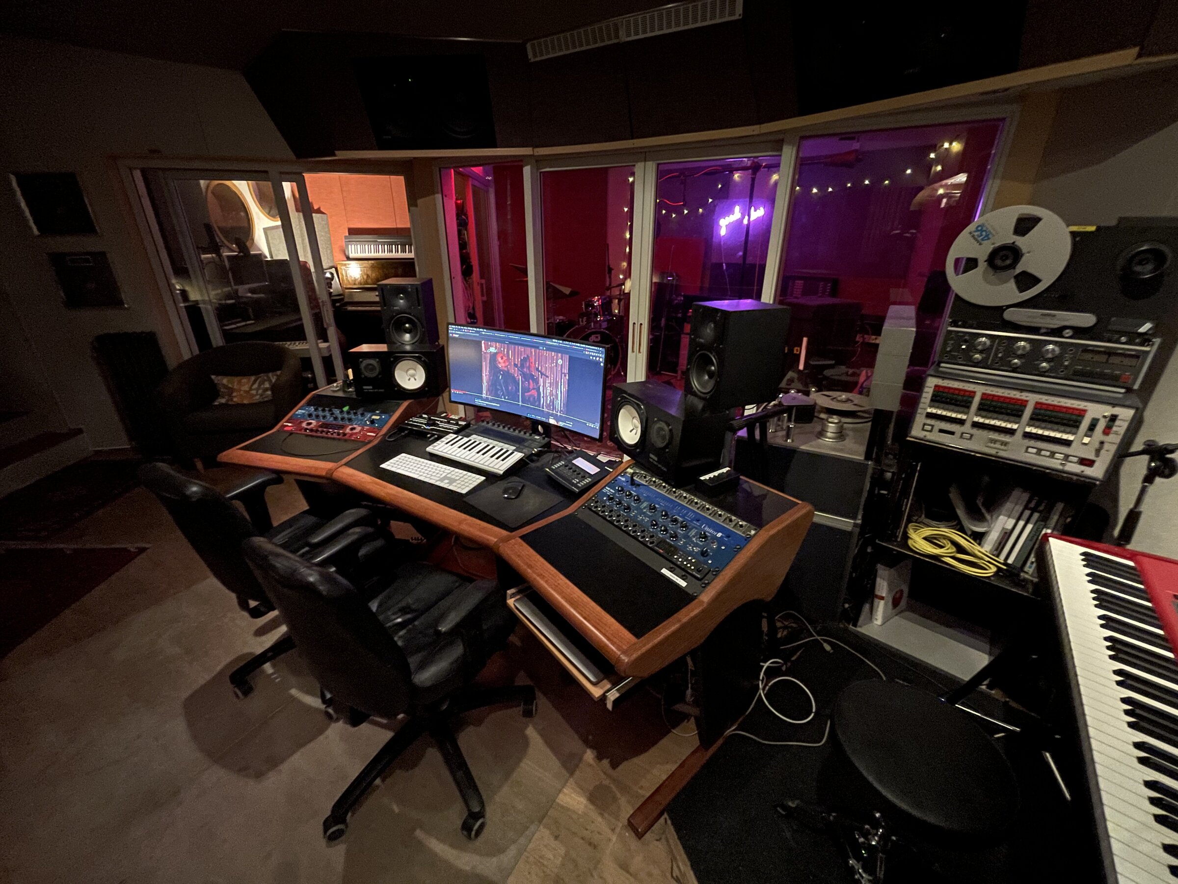 Control room mixing desk with outboard rack and tape machine