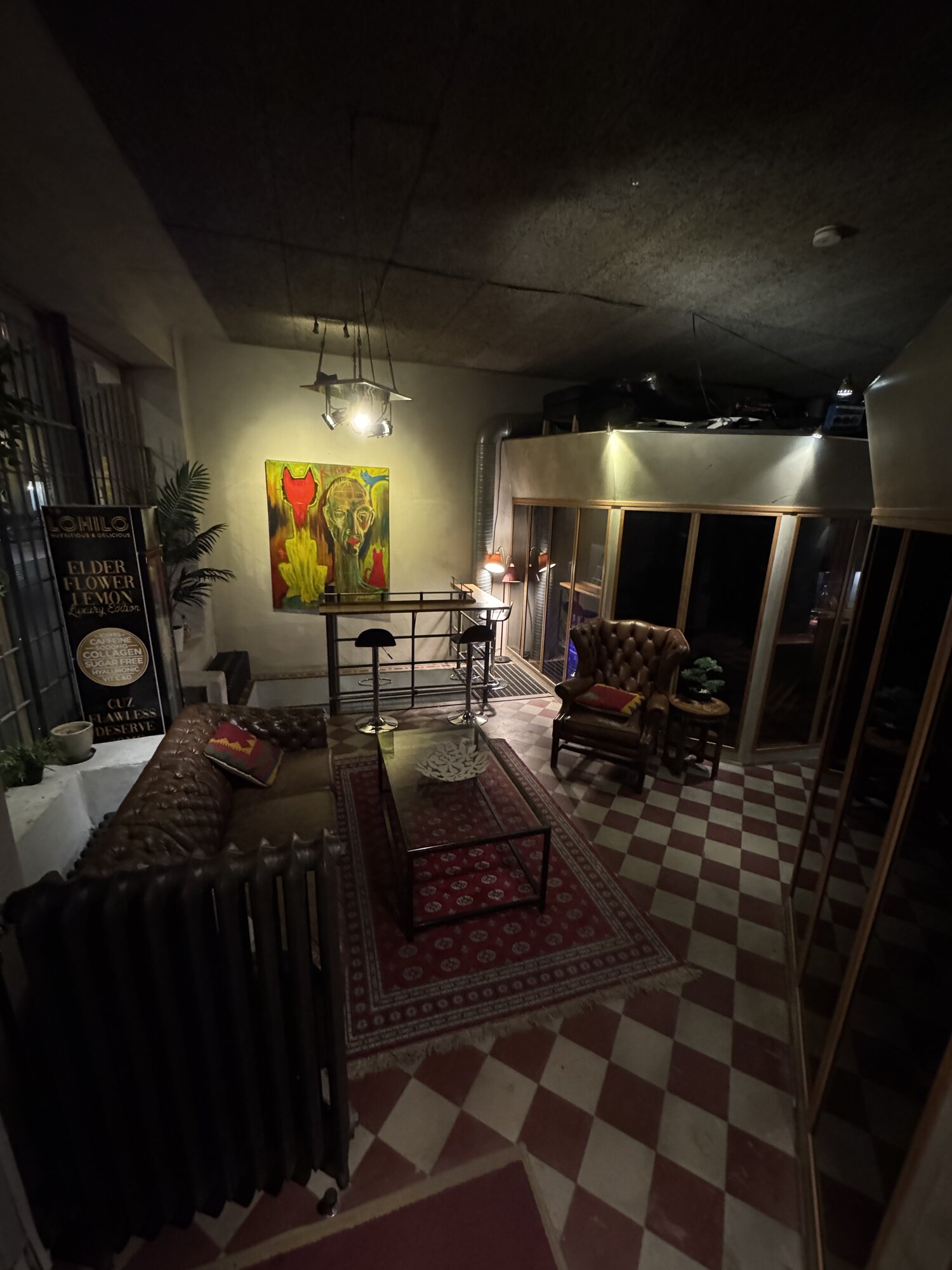 Lounge corner with original artwork and bar seating